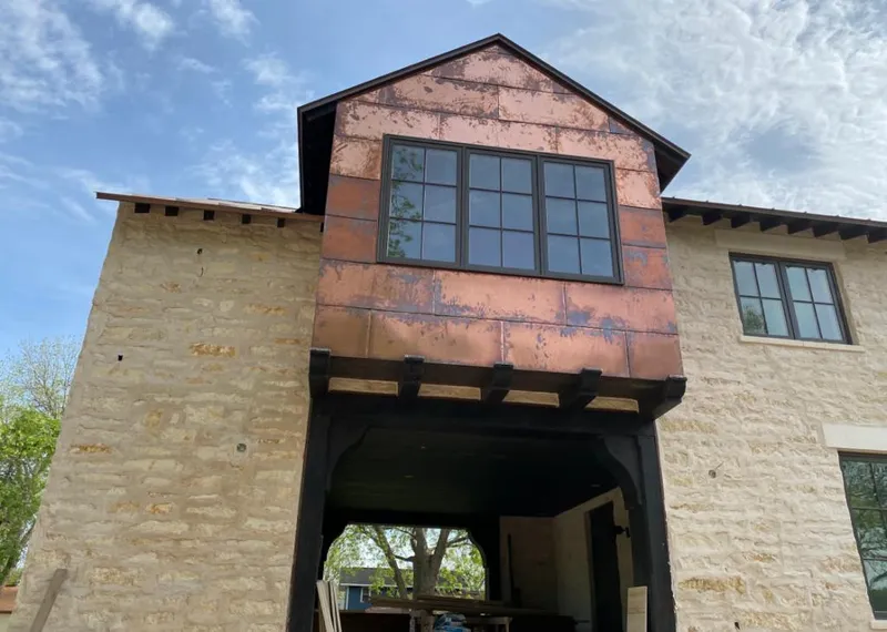 Copper metal panel facade on a stone building for Skylight Installation in Waihee-Waiehu