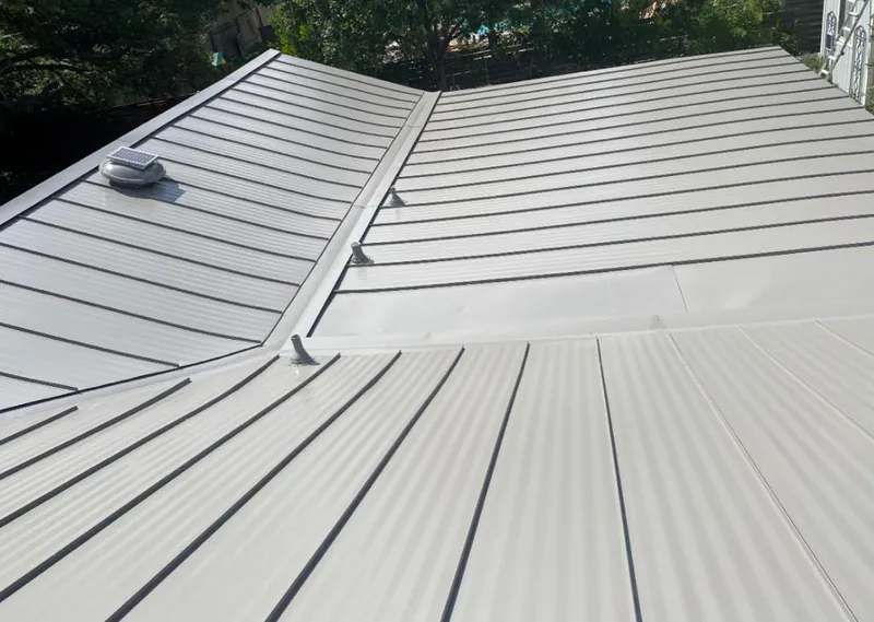 Solar attic fan installed on a metal roof for Roof Ventilation in Waihee-Waiehu
